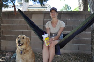 My wife getting some relaxing time with our golden retriever in the hammock 