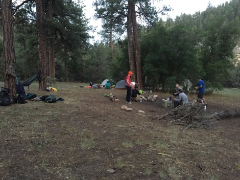 Everyone getting their meals and such together for camp dinner